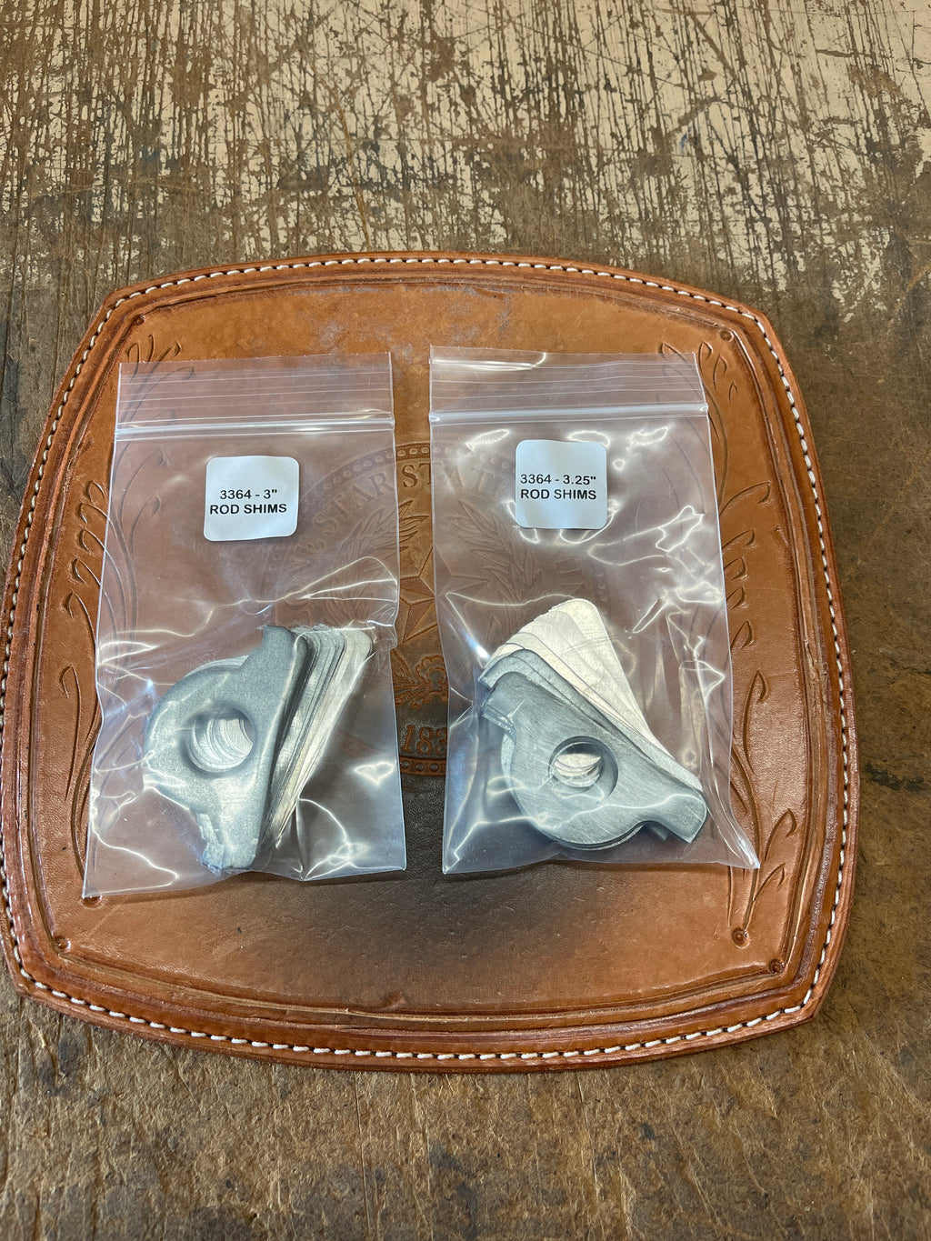 3364 GASO Connecting rod bearings shim sets. Two sizes shown, 3" and 3 1/4", shown in each's respective bag. 