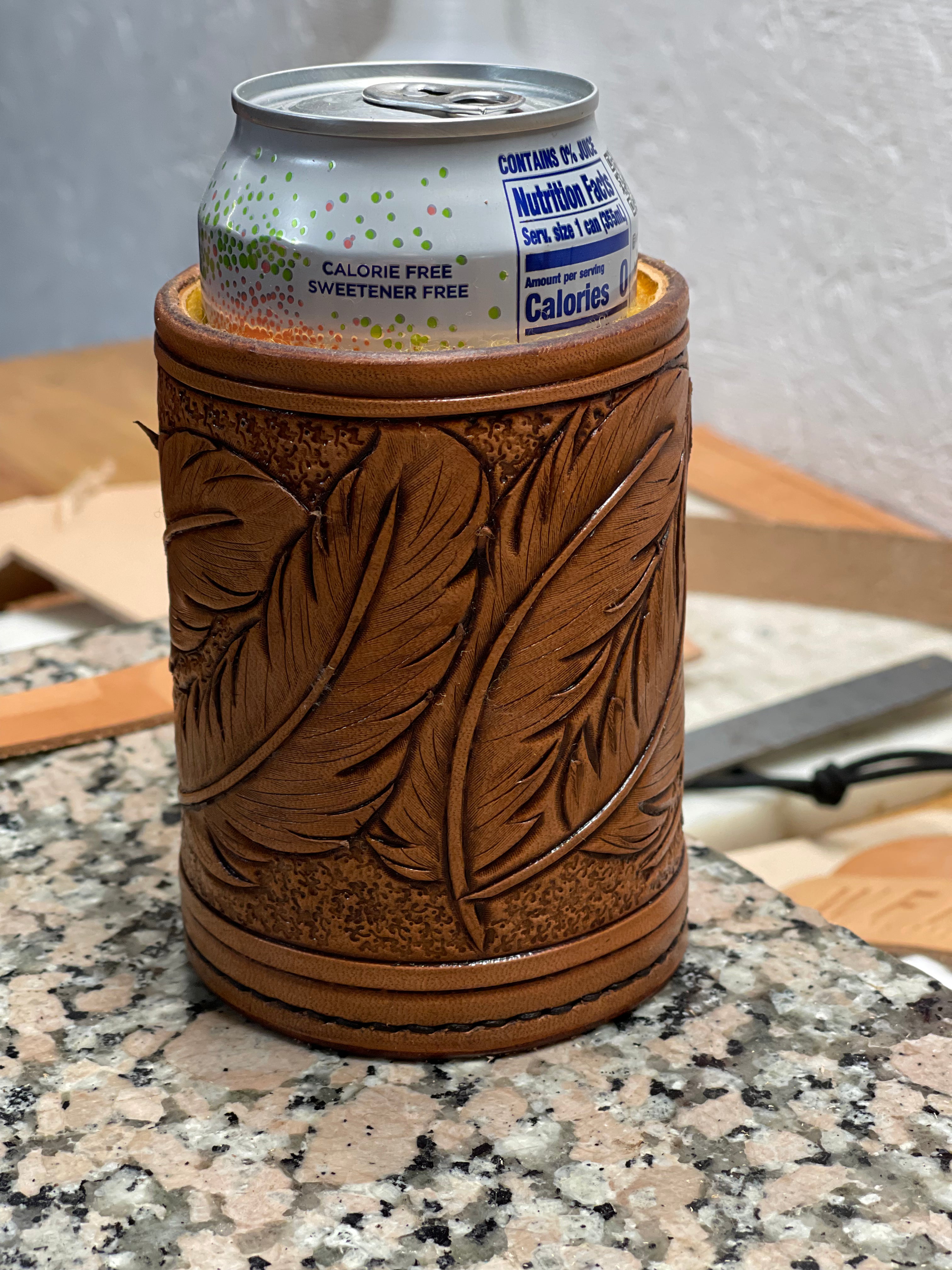 Feather tooled, shearling lined drink coozie